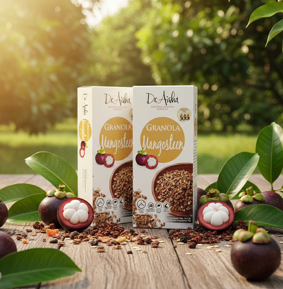 Two boxes of Dr. Aisha Granola with mangosteens on a wooden table outdoors.