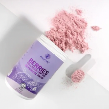 Supplement powder with a scoop on a white background