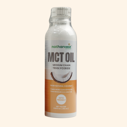 Bottle of Natharvest MCT oil on a light beige background