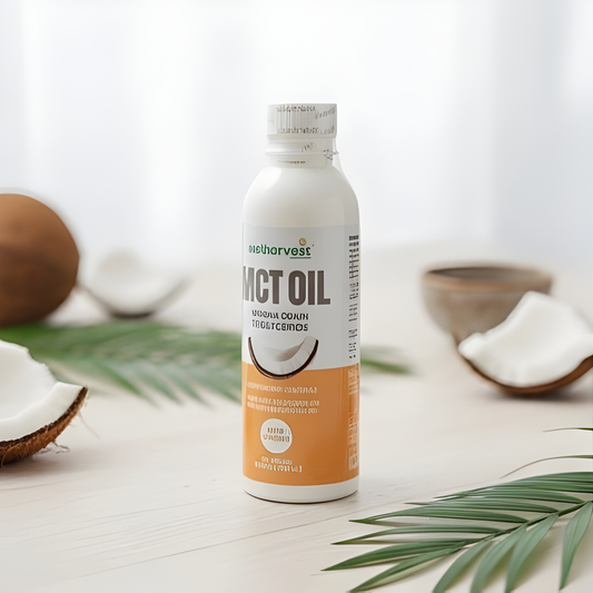 Bottle of Nect Oil with coconut halves and leaves on a light background