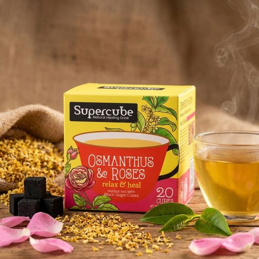 Supercube Osmanthus & Roses tea packaging with a steaming cup of tea on a wooden surface.